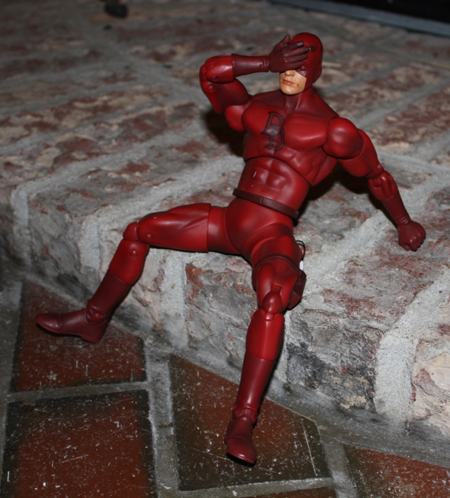 Daredevil recovers from a nasty fall on the pavement.