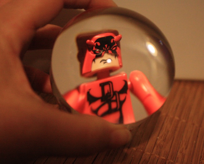 Daredevil minimate viewed through a dome magnifier.