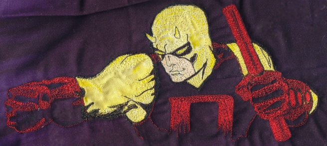 close up of my rendering of Tim Sale's art from Daredevil: Yellow as thread painting